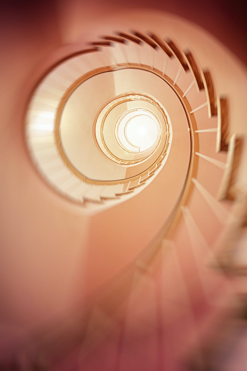 Low Angle Photography of Spiral Stair