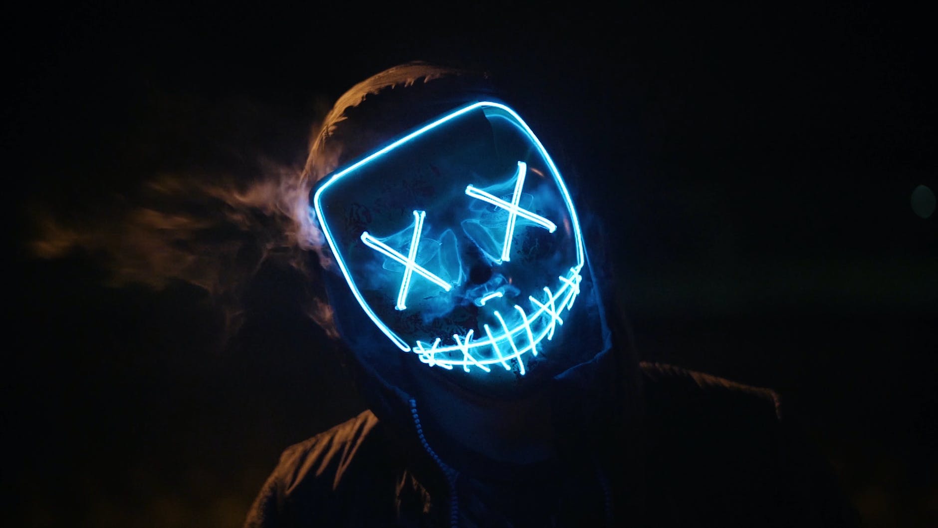 Man Wearing Black and Blue Mask Costume